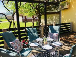 a table and chairs on a patio at Apartmán Perspekta 196 in Čatež ob Savi