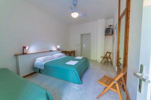 A bed or beds in a room at Albergo Le Querce