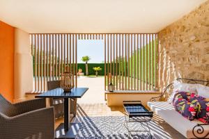 a living room with a couch and a table at La Petite Aiguebonne in Allex