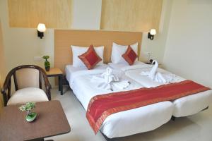 Postel nebo postele na pokoji v ubytování Hotel Yatharth Inn + 37 fotografií