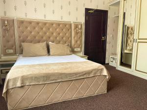Ένα ή περισσότερα κρεβάτια σε δωμάτιο στο Рестотель Oscar