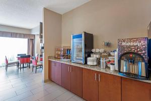 a kitchen with a counter with a drink dispenser at Comfort Inn Elizabeth City near University in Elizabeth City