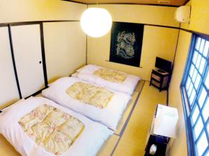 Tempat tidur dalam kamar di Rickshaw inn