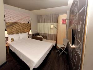 Cama ou camas em um quarto em ibis Natal