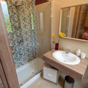 a bathroom with a sink and a shower with a sink at Il Tufo in Montesano sulla Marcellana