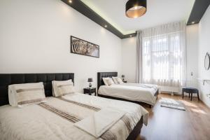 Posteľ alebo postele v izbe v ubytovaní Real Apartments Zichy