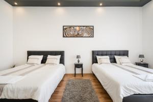Posteľ alebo postele v izbe v ubytovaní Real Apartments Zichy + 37 fotografií