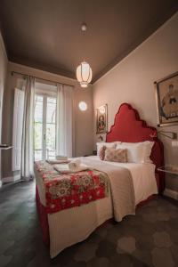 Ένα ή περισσότερα κρεβάτια σε δωμάτιο στο La Fonderia Firenze