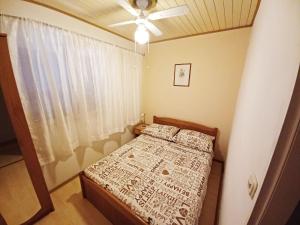 Postel nebo postele na pokoji v ubytování Apartments Carmen Vinisce