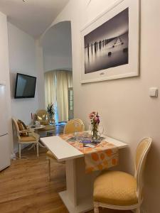 a dining room with a table and chairs at Apartmány u sv. Michaela in Kadaň