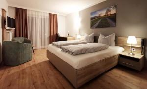 Ein Bett oder Betten in einem Zimmer der Unterkunft HoFer am Zeitberg - Ferienwohnungen