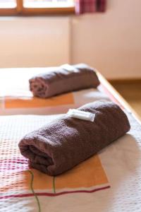 two towels are sitting on top of a table at Penzion U Zlomené lyže in Železná Ruda