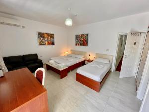 Postel nebo postele na pokoji v ubytování Vila Ada Hotel