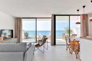 a living room with a view of the ocean at ECO-APARTMENTS LA MARINEDA in Roses