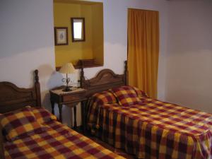 Posteľ alebo postele v izbe v ubytovaní Casas Rurales Jardines del Visir