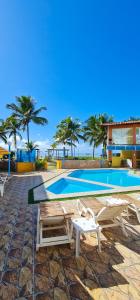 Bazén v ubytování Hotel Brisa dos Abrolhos nebo v jeho okolí