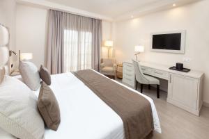 Postel nebo postele na pokoji v ubytování Hotel RIU Garoé