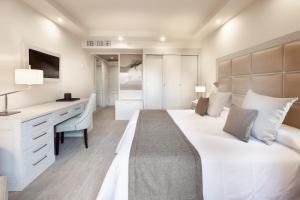 Postel nebo postele na pokoji v ubytování Hotel RIU Garoé