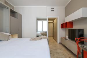 Postel nebo postele na pokoji v ubytování Contempora Apartments - Elvezia 8 - E31