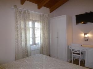 Postel nebo postele na pokoji v ubytování Relais Villa Giulia