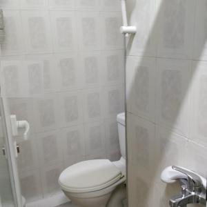 A bathroom at Vacations in Patra Rooms