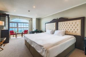 Postel nebo postele na pokoji v ubytování Aria Hotel