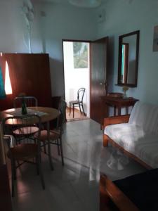 a living room with a table and a couch at Apartment Božava - Nena in Božava