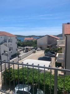 a view from the balcony of a parking lot at Apartmani Džapo in Srima