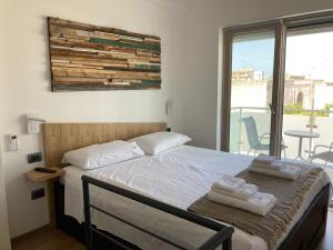 Postel nebo postele na pokoji v ubytování La Casetta 2.0 + 22 fotografií