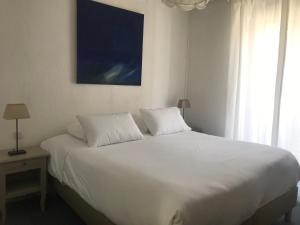 Katil atau katil-katil dalam bilik di Appartement en coeur de ville 2 à 4 personnes