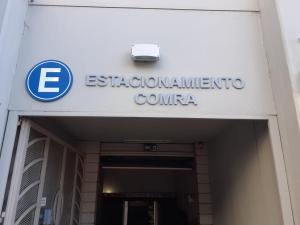 a sign for the entrance to an eskom international convention center at Apart Hotel Comra in Buenos Aires
