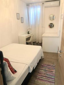 Postel nebo postele na pokoji v ubytování Apartments & Rooms Formenti