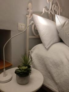 Postel nebo postele na pokoji v ubytování Noi Due a Cortona