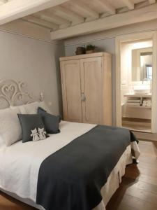 Postel nebo postele na pokoji v ubytování Noi Due a Cortona
