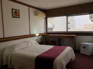 Säng eller sängar i ett rum på Hotel Continental