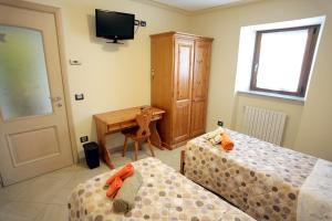 Postel nebo postele na pokoji v ubytování Bed and Breakfast Luna
