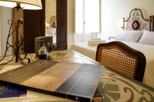 Postel nebo postele na pokoji v ubytování B&B I sei volti Lecce