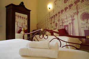 Postel nebo postele na pokoji v ubytování B&B I sei volti Lecce