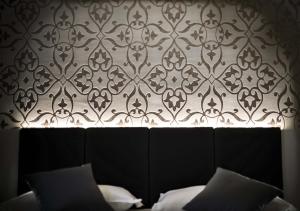 Posteľ alebo postele v izbe v ubytovaní Ilga Hotel