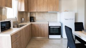 A cozinha ou cozinha compacta de Mythic Villas