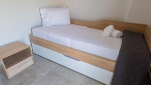 Cama ou camas em um quarto em Mythic Villas