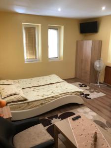 Postel nebo postele na pokoji v ubytování Relax Bogács