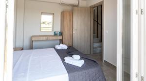 Cama ou camas em um quarto em Mythic Villas