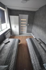 Posteľ alebo postele v izbe v ubytovaní JDK Apartamenty Mickiewicza 34m2 4-osobowy