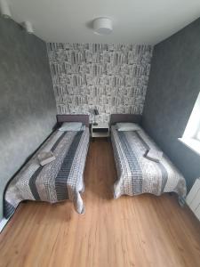 Posteľ alebo postele v izbe v ubytovaní JDK Apartamenty Mickiewicza 34m2 4-osobowy