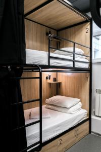 a couple of bunk beds in a room at Why Not Hostel Novosibirsk in Novosibirsk