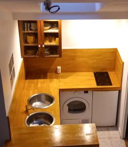 a small kitchen with a sink and a sink at STUDIO PROCHE PARIS ET DISNEYLAND PARIS in Champigny-sur-Marne