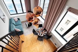 an overhead view of a living room with a table and chairs at Bob W Duo Lofts in Tartu