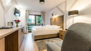 Posteľ alebo postele v izbe v ubytovaní Apartamenty Kapitańskie