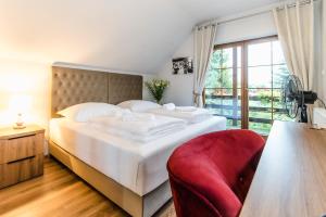 Posteľ alebo postele v izbe v ubytovaní Apartamenty Kapitańskie